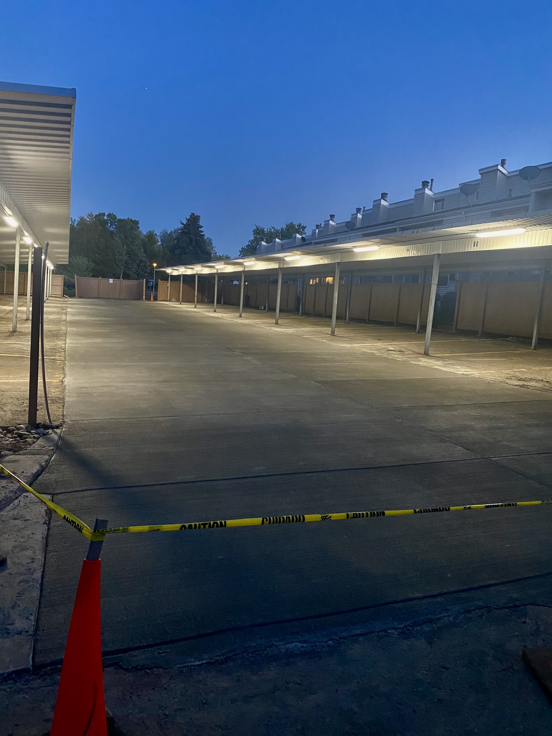 Re-poured HOA parking lot at dusk