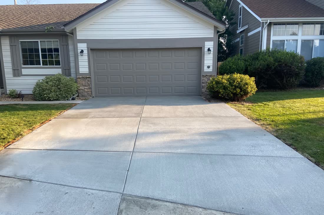 Freshly poured driveway taped off while it cures