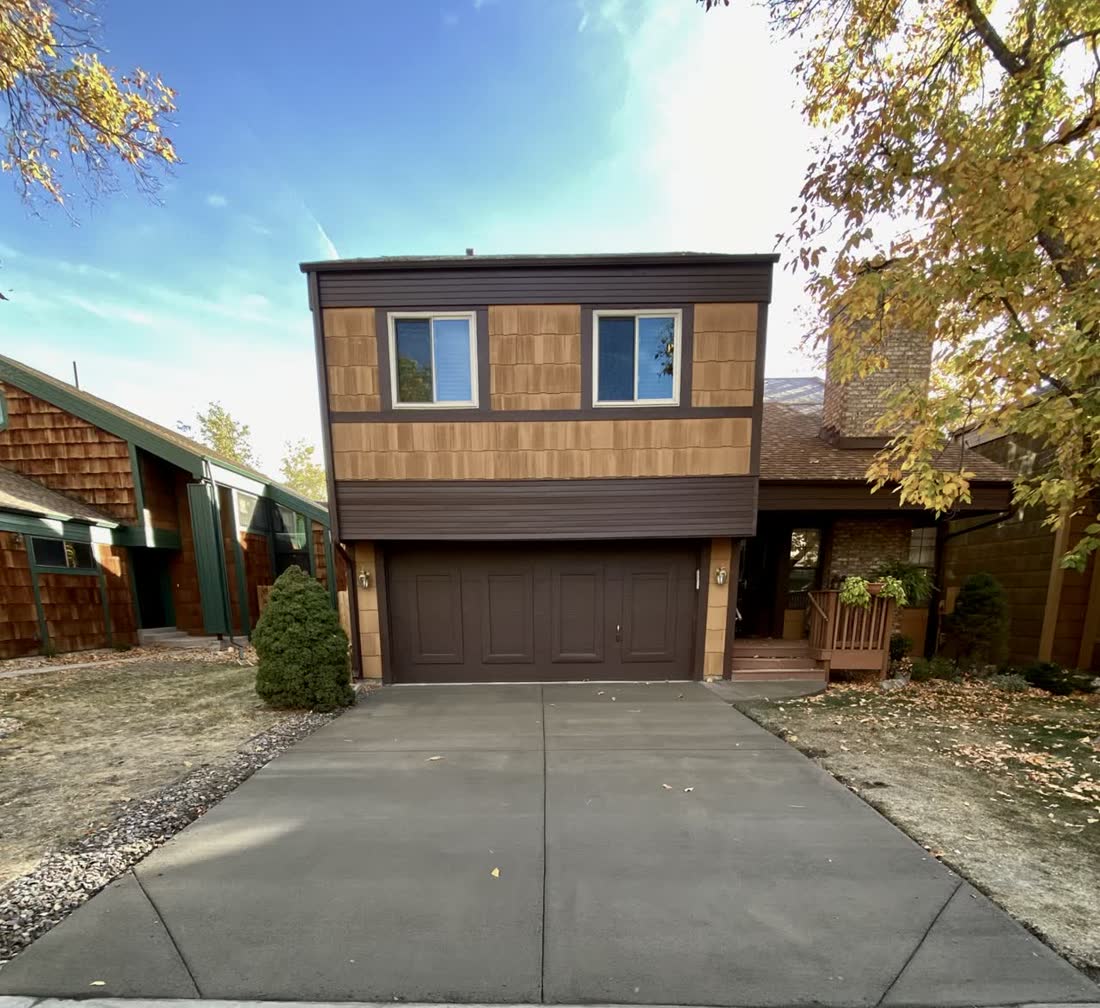 Finished two-car concrete driveway in front of a family home